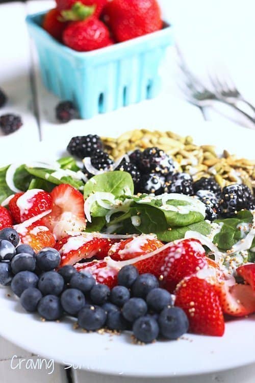 This Very Berry Spinach Salad is the best way to enjoy fresh seasonal berries. Don't skip the tangy citrus yogurt dressing and popped quinoa for extra crunch! @Craving Something Healthy