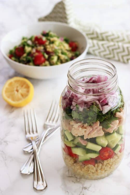 Tuna & Freekeh Tabouli Salad layered in a large mason jar.