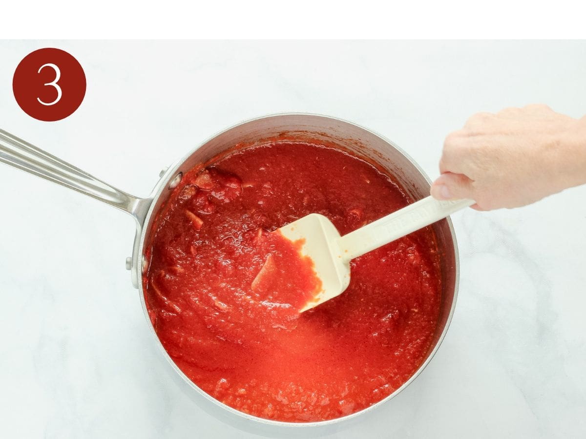 Step 3 to make easy pasta sauce. Add the tomatoes and salt.