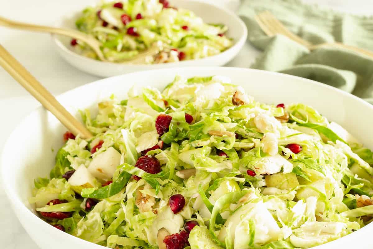 A bowl of shaved Brussels sprouts salad.