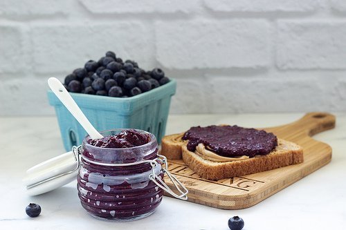 a container of homemade blueberry rhubarb chia jam