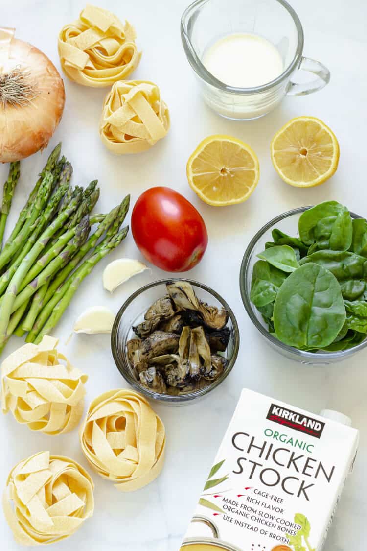 Overhead shot of ingredients to make pappardelle pasta primavera