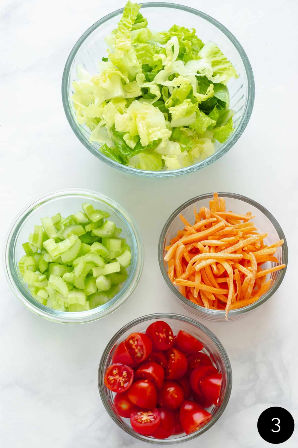 4 bowls of chopped vegetables for Buffalo chicken rice bowls.